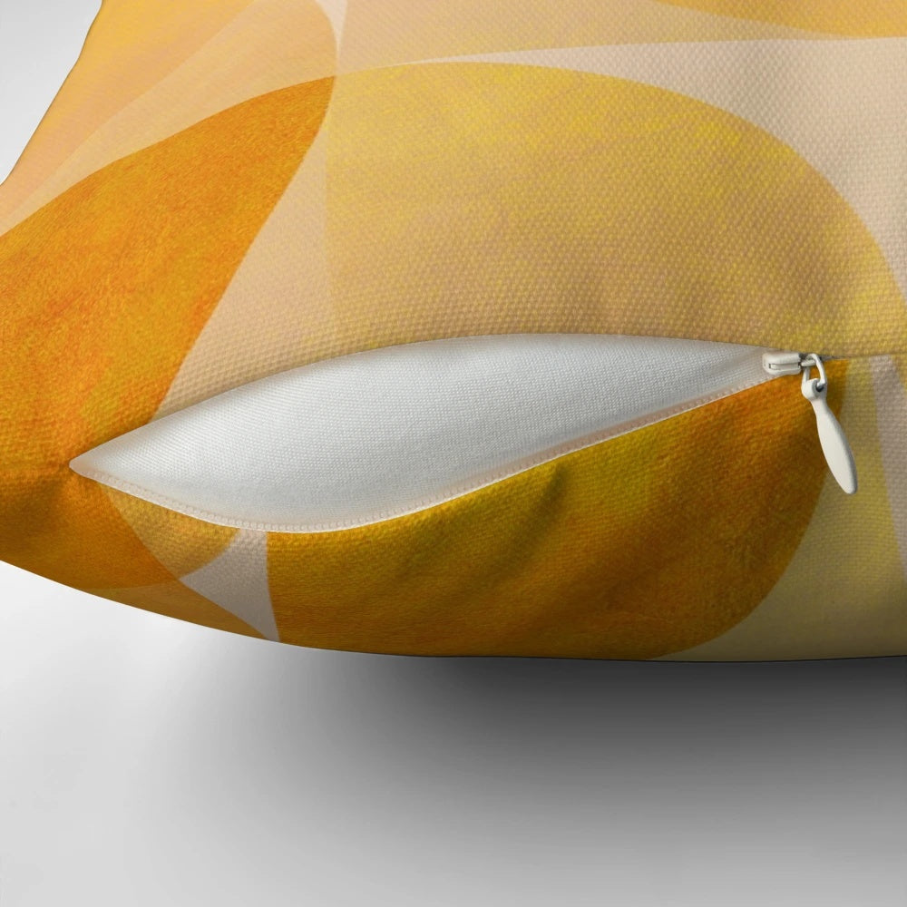 Golden mid-century modern geometric throw pillow with abstract circle and semicircle shapes