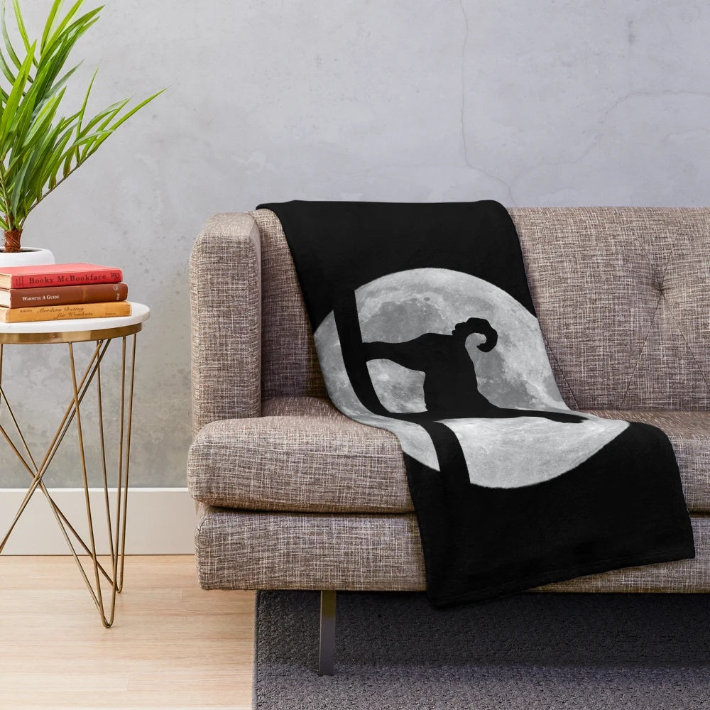 Cozy goldendoodle plush blanket featuring a goldendoodle silhouette in front of the night moon