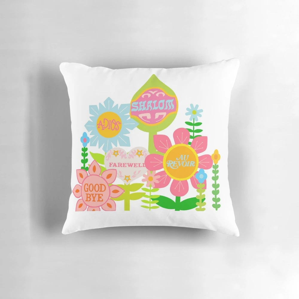 Colorful "It's a Small World" themed pillow with floral design