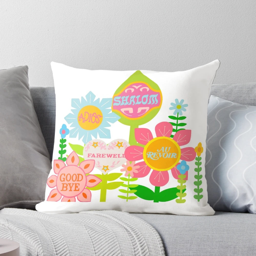 Colorful "It's a Small World" themed pillow with floral design