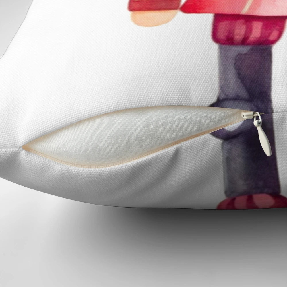 Goofy-looking nutcracker illustration printed on a plush Christmas pillow