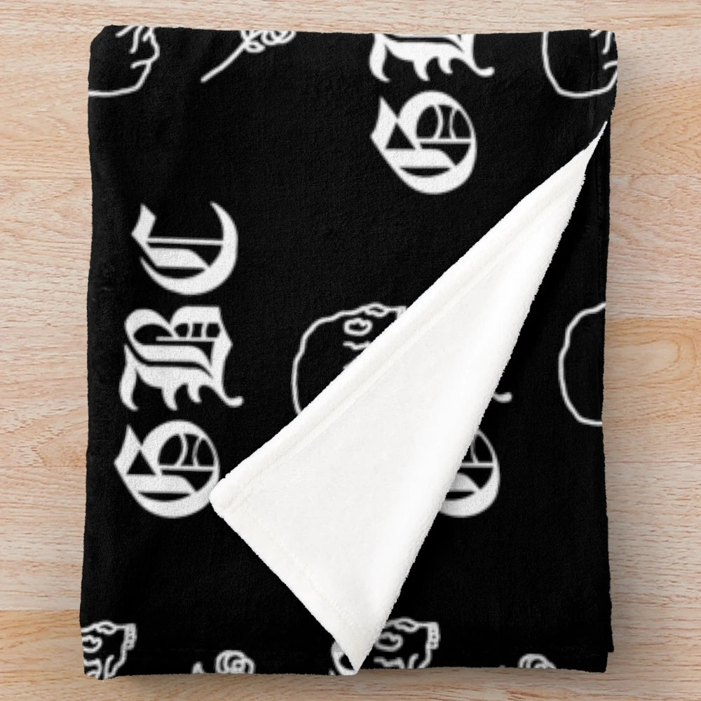Goth-inspired plush blanket featuring music-themed design