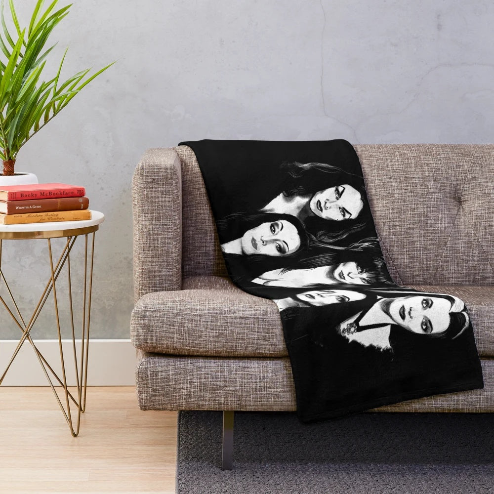 Goth-Inspired Plush Blanket featuring iconic gothic figures like Elvira, Vampira, Lily Munster, and Morticia Addams