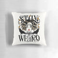 A decorative pillow featuring a gothic, witchy design with a raven and rose.