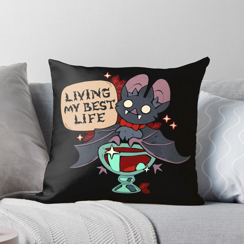Decorative pillow featuring a cute vampire bat design with the text "Living My Best Life