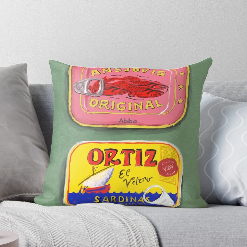Colorful decorative pillow featuring a painting of tinned seafood like anchovies and sardines