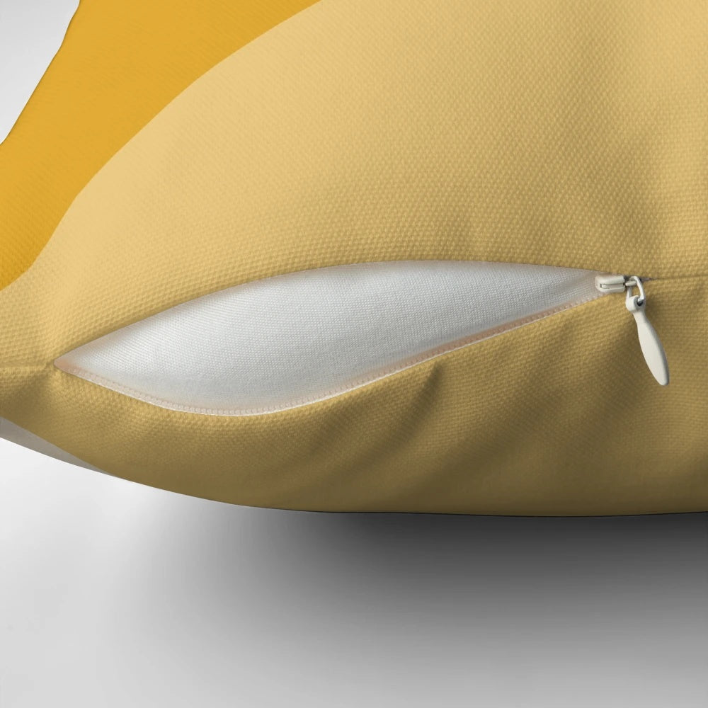 Mustard yellow gradient geometric pattern pillow with a modern, minimalist design