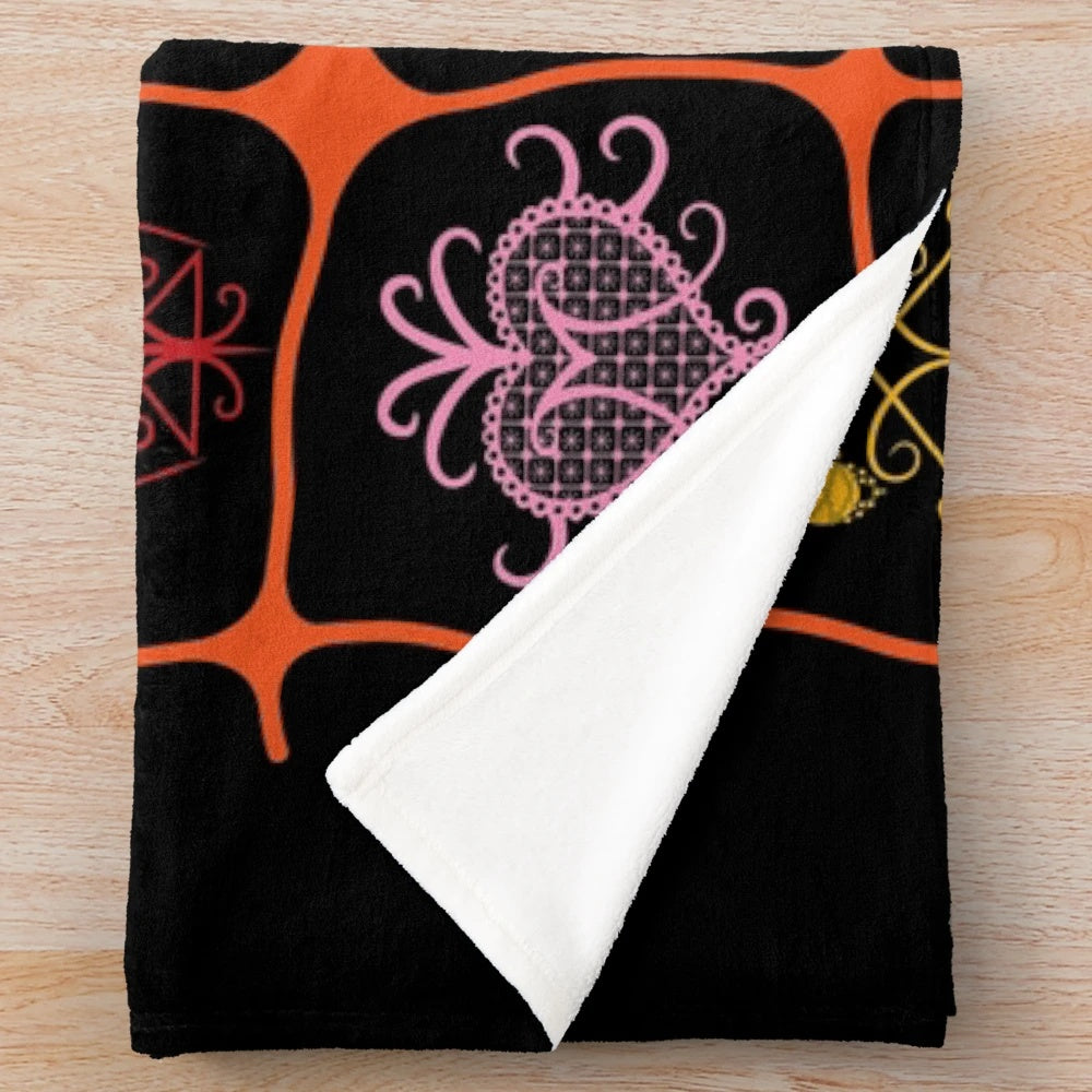 Grann Brijit plush blanket featuring Haitian voodoo symbols and cultural elements