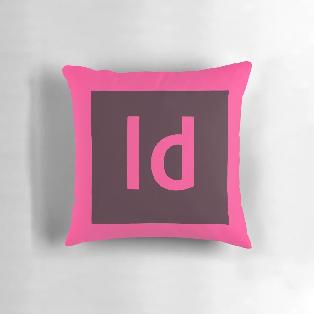 A decorative pillow featuring the Adobe InDesign logo, designed to enhance creative workspaces.