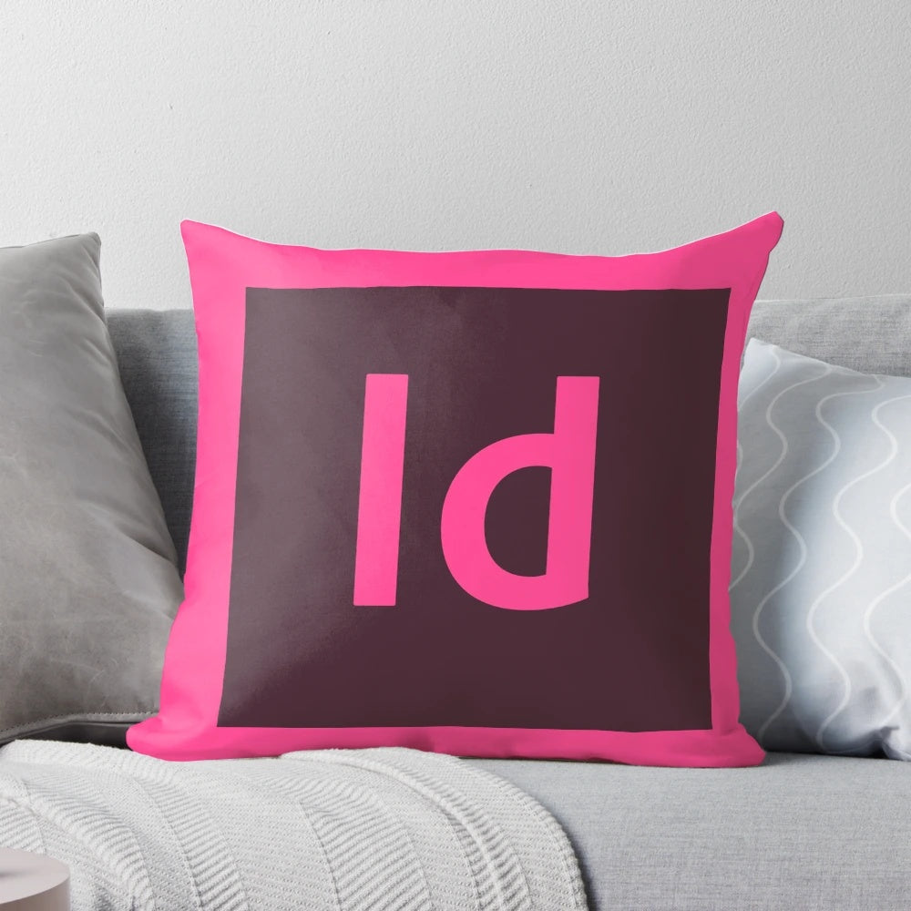 A decorative pillow featuring the Adobe InDesign logo, designed to enhance creative workspaces.
