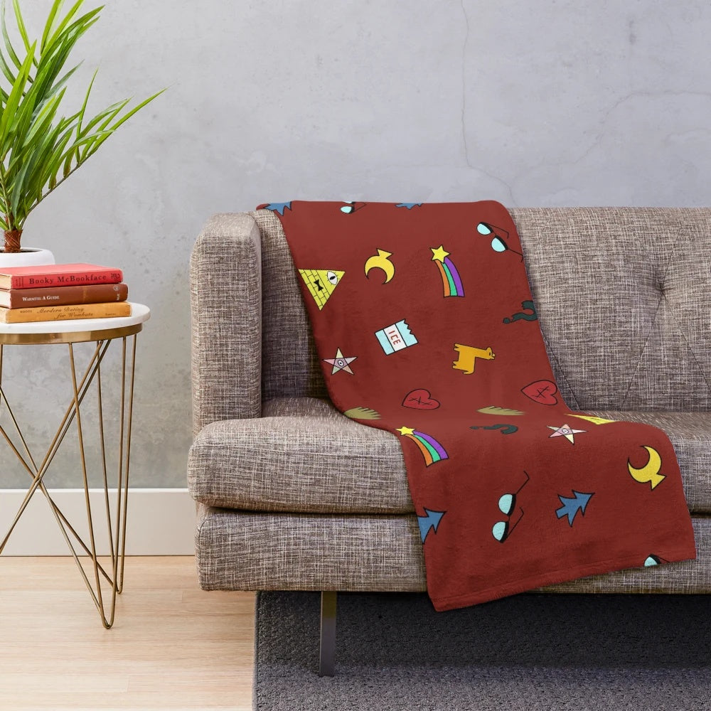 Gravity Falls inspired plush throw blanket with cartoon symbols like pine trees, shooting stars, and triangles