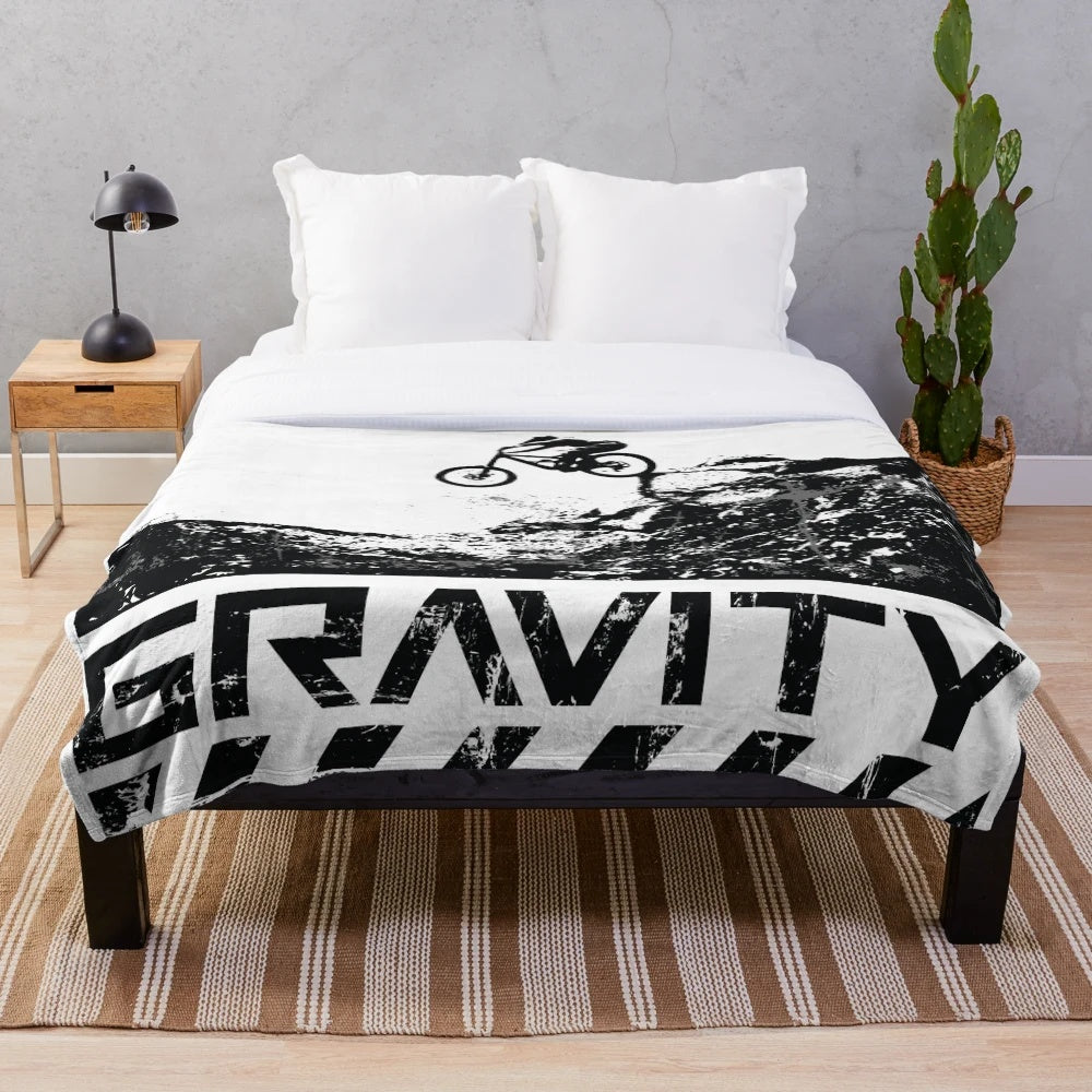 Downhill mountain biking silhouette design on a plush blanket