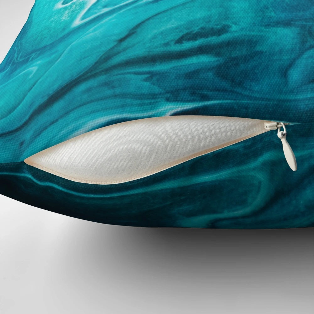 Gravity II modern decorative pillow with abstract teal and green swirl design