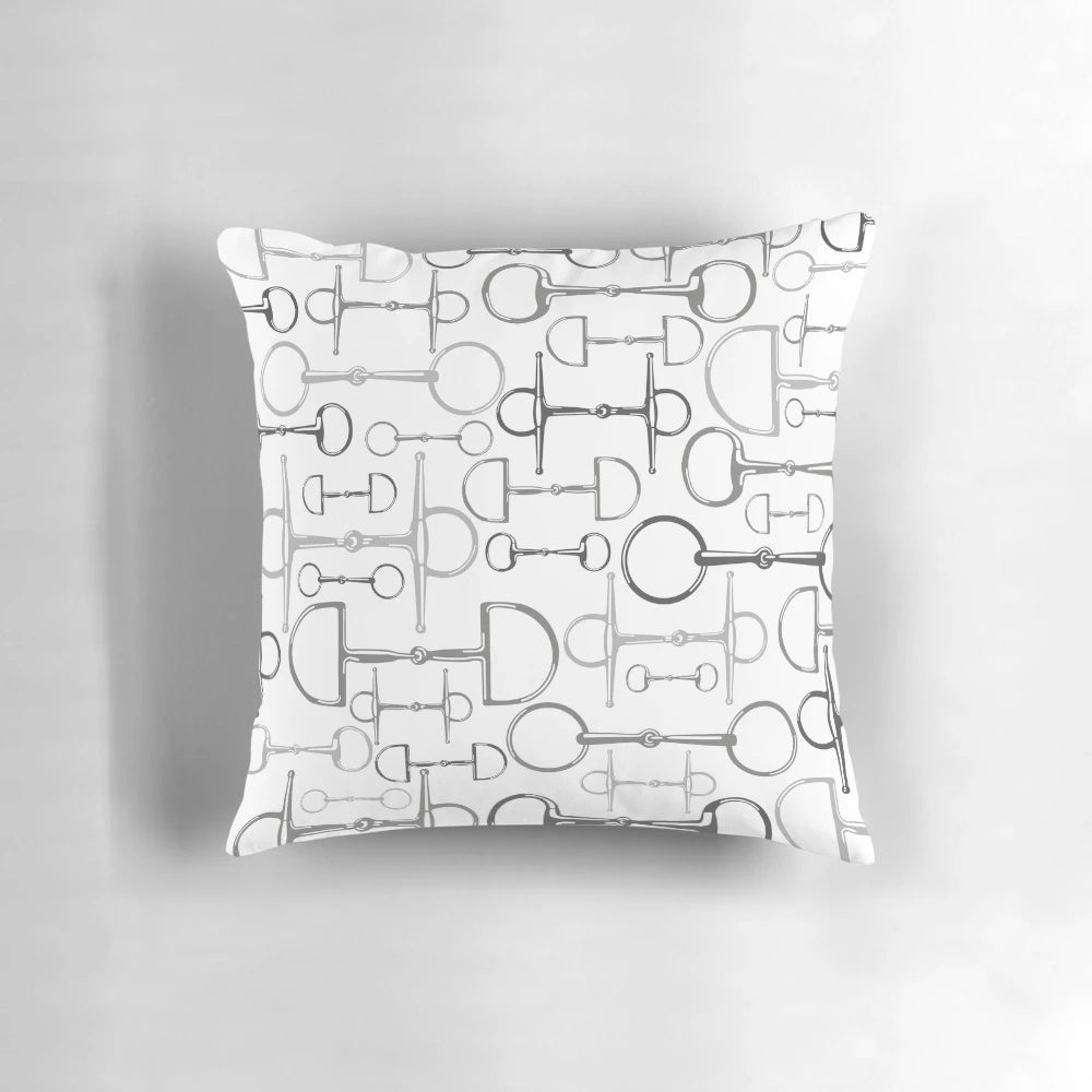 Gray and white pillow with horse bit design for equestrian-themed home decor