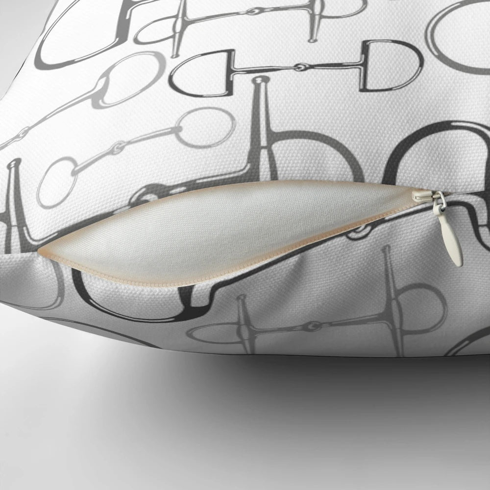 Gray and white pillow with horse bit design for equestrian-themed home decor