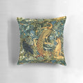 Green floral pillow featuring a vintage-inspired design with peacock, raven, and other forest animals in a lush, botanical setting.