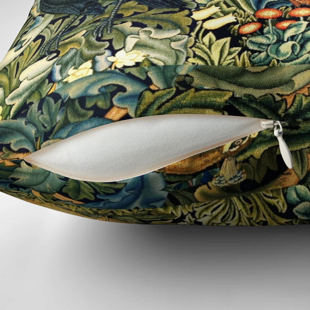 Green floral pillow featuring a vintage-inspired design with peacock, raven, and other forest animals in a lush, botanical setting.