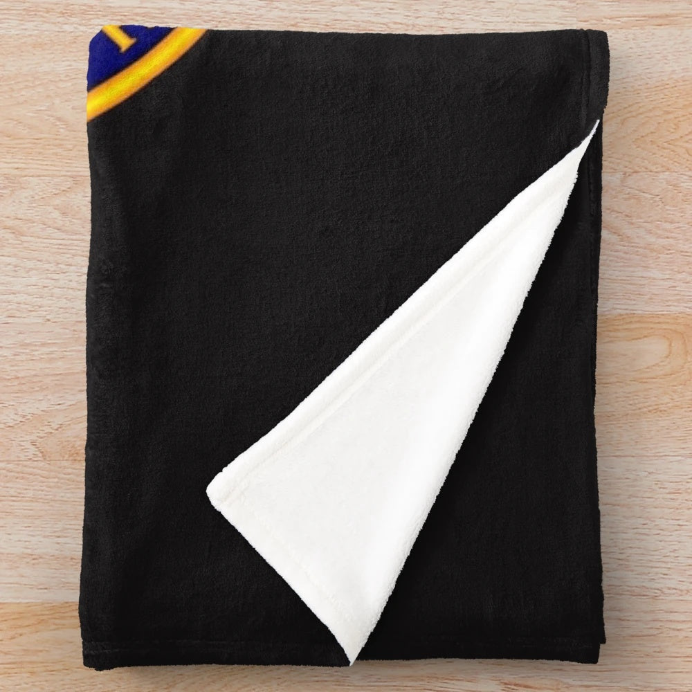 Grenadier Guards-inspired plush blanket with military insignia design