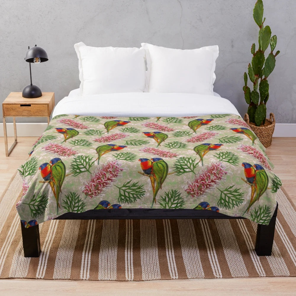 Colorful Australian plush blanket with a grevillea and rainbow lorikeet bird pattern