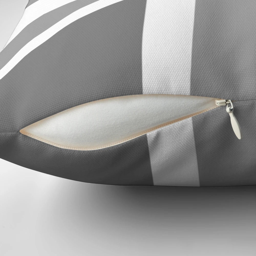 Grey and white Union Jack flag printed on a decorative throw pillow
