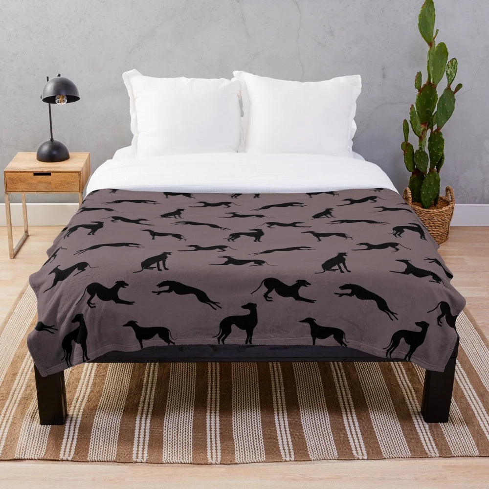 Greyhound silhouette design on a soft, plush blanket