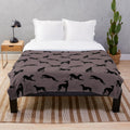 Greyhound silhouette design on a soft, plush blanket