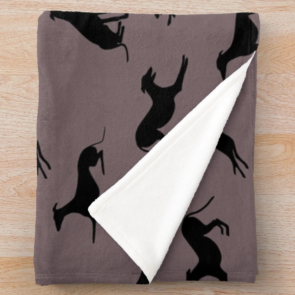 Greyhound silhouette design on a soft, plush blanket