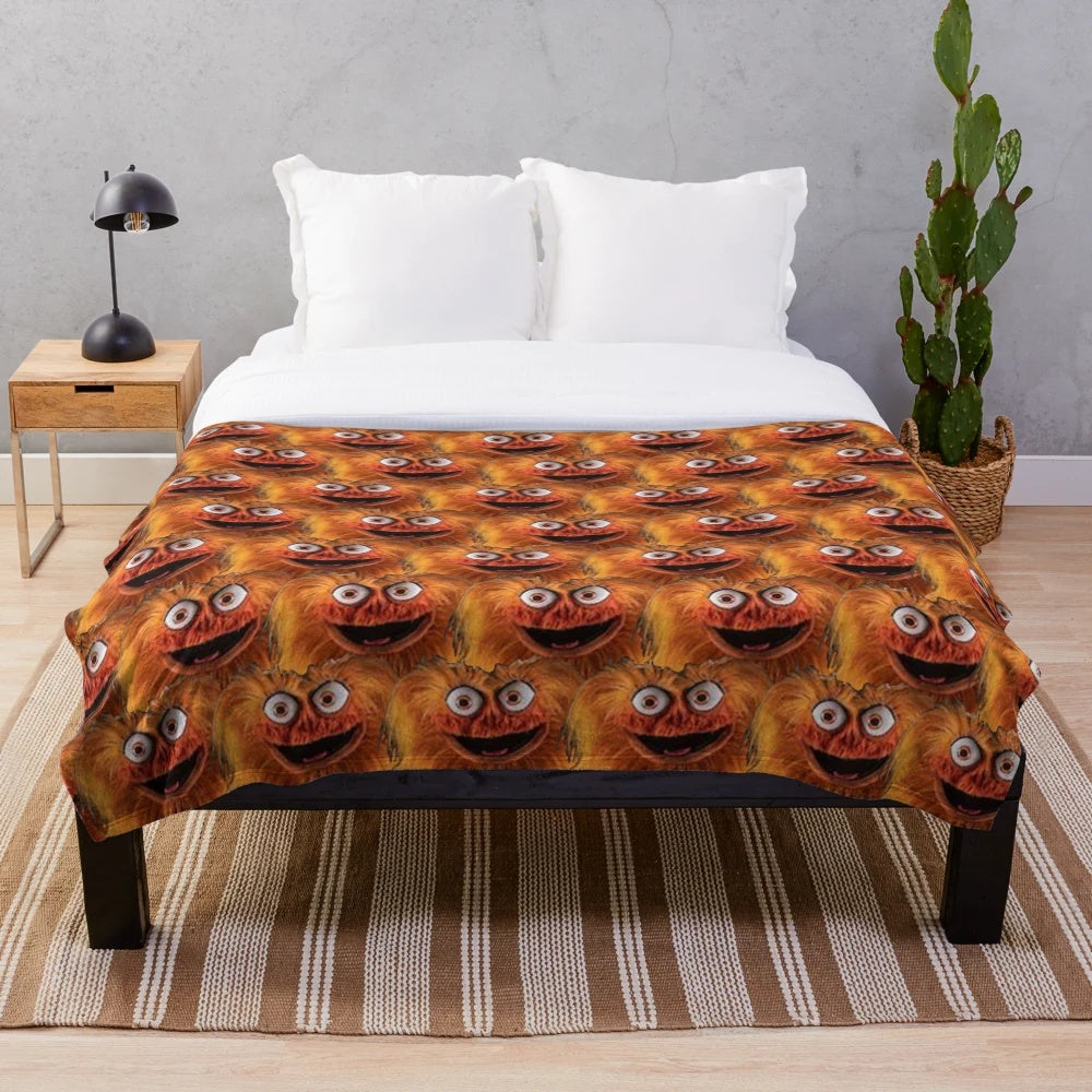 Gritty-inspired plush blanket with Philly sports team colors and imagery
