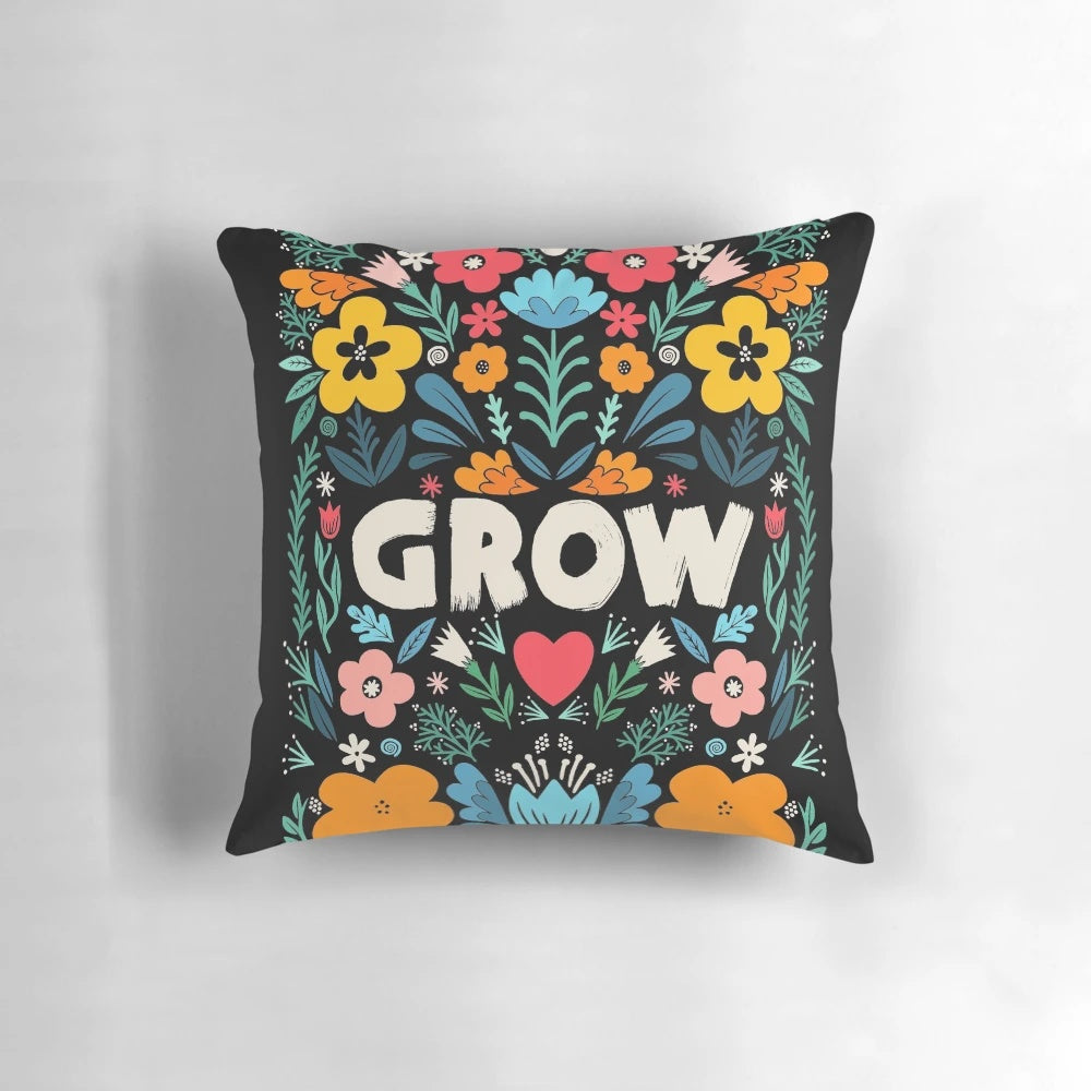 A decorative pillow featuring a garden-inspired floral typography design with a growth-focused quote.