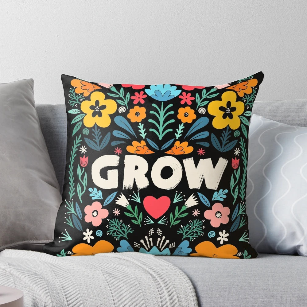 A decorative pillow featuring a garden-inspired floral typography design with a growth-focused quote.
