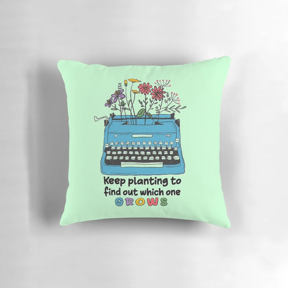 Keep Planting to Find Out Which One Grows" Pillow featuring a typewriter and plant design