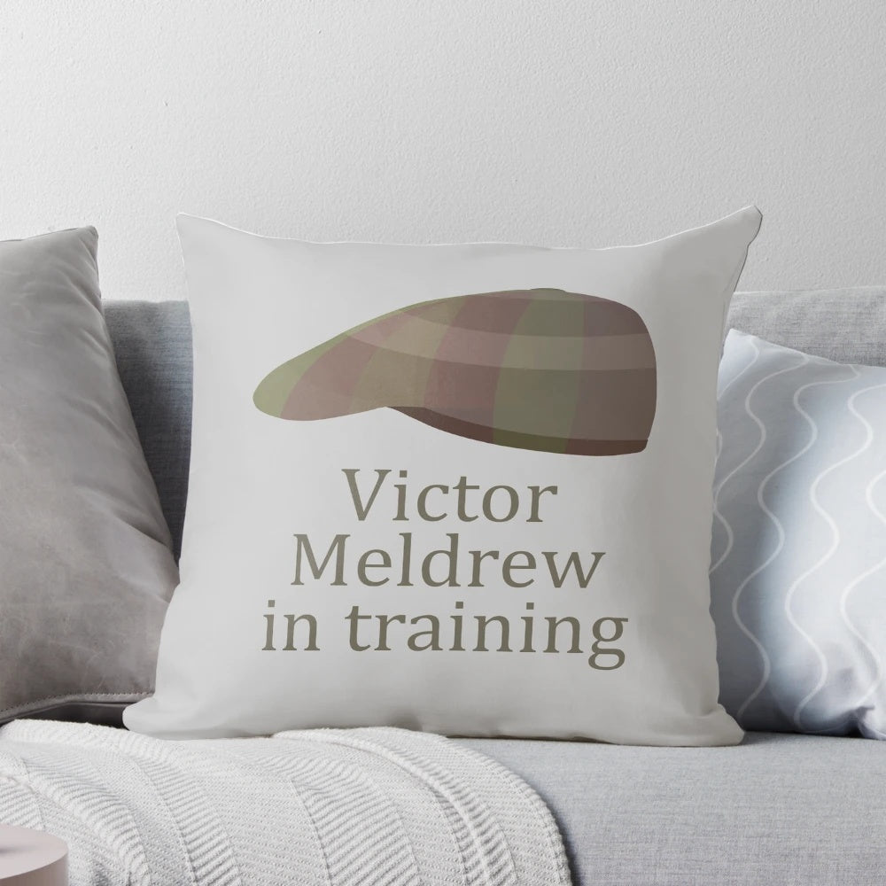 Vintage-inspired flat cap design pillow featuring a grumpy old man, reminiscent of the BBC sitcom One Foot in the Grave.