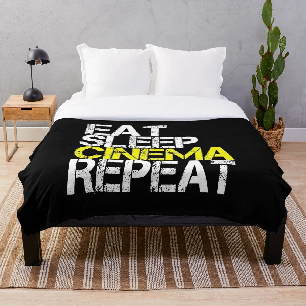 Grunge plush blanket with "Eat Sleep Cinema Repeat" design