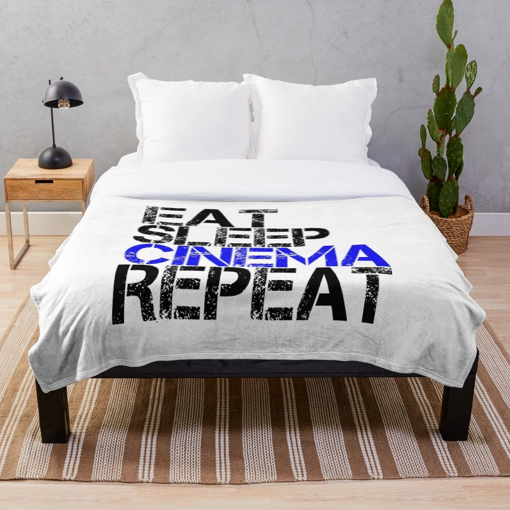 Grunge plush blanket with "Eat Sleep Cinema Repeat" design