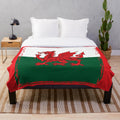 Grunge Welsh flag plush blanket featuring the iconic Welsh dragon symbol