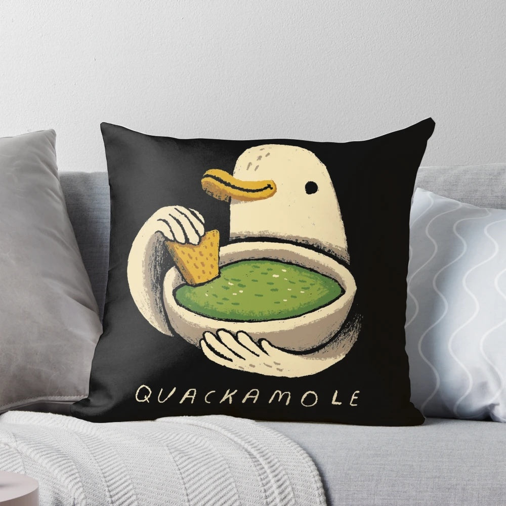 Colorful decorative pillow featuring a quacamole design with an avocado and a duck