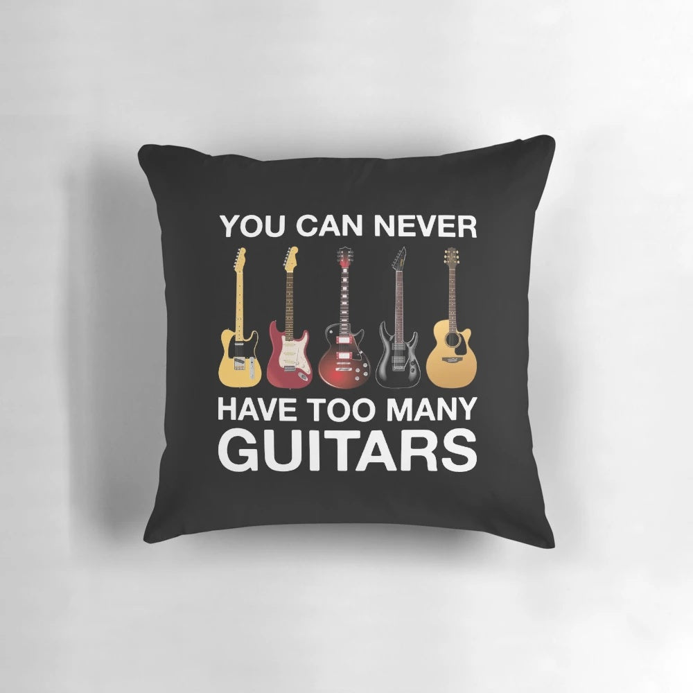 A cozy pillow featuring an electric guitar and the phrase "You Can Never Have Too Many Guitars