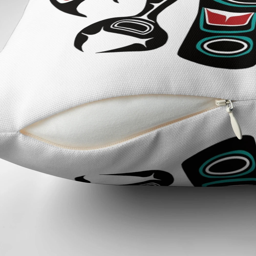Haida-inspired raven totem design on a decorative pillow