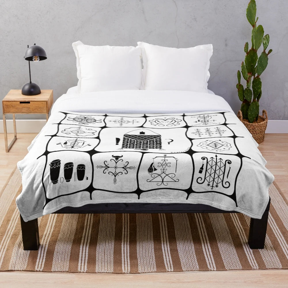 Haitian inspired plush blanket with voodoo symbols and Kesler Pierre art