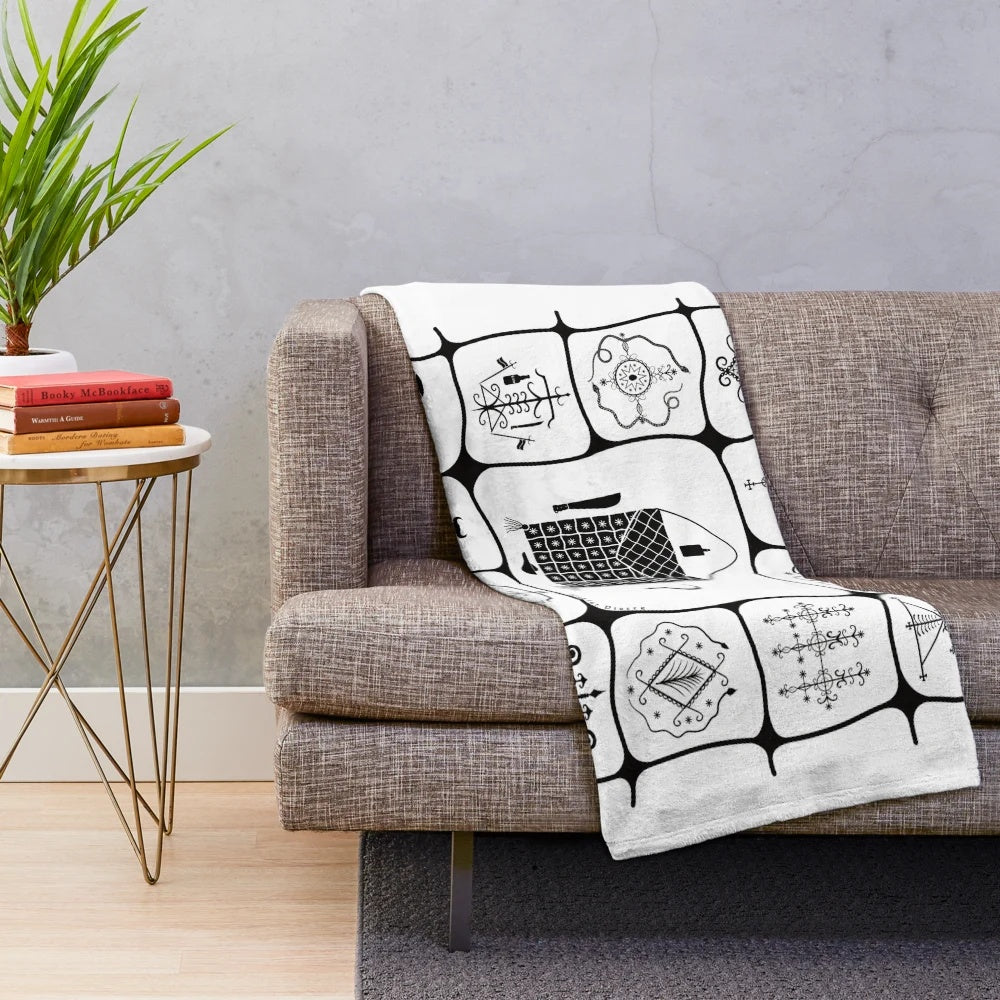 Haitian inspired plush blanket with voodoo symbols and Kesler Pierre art