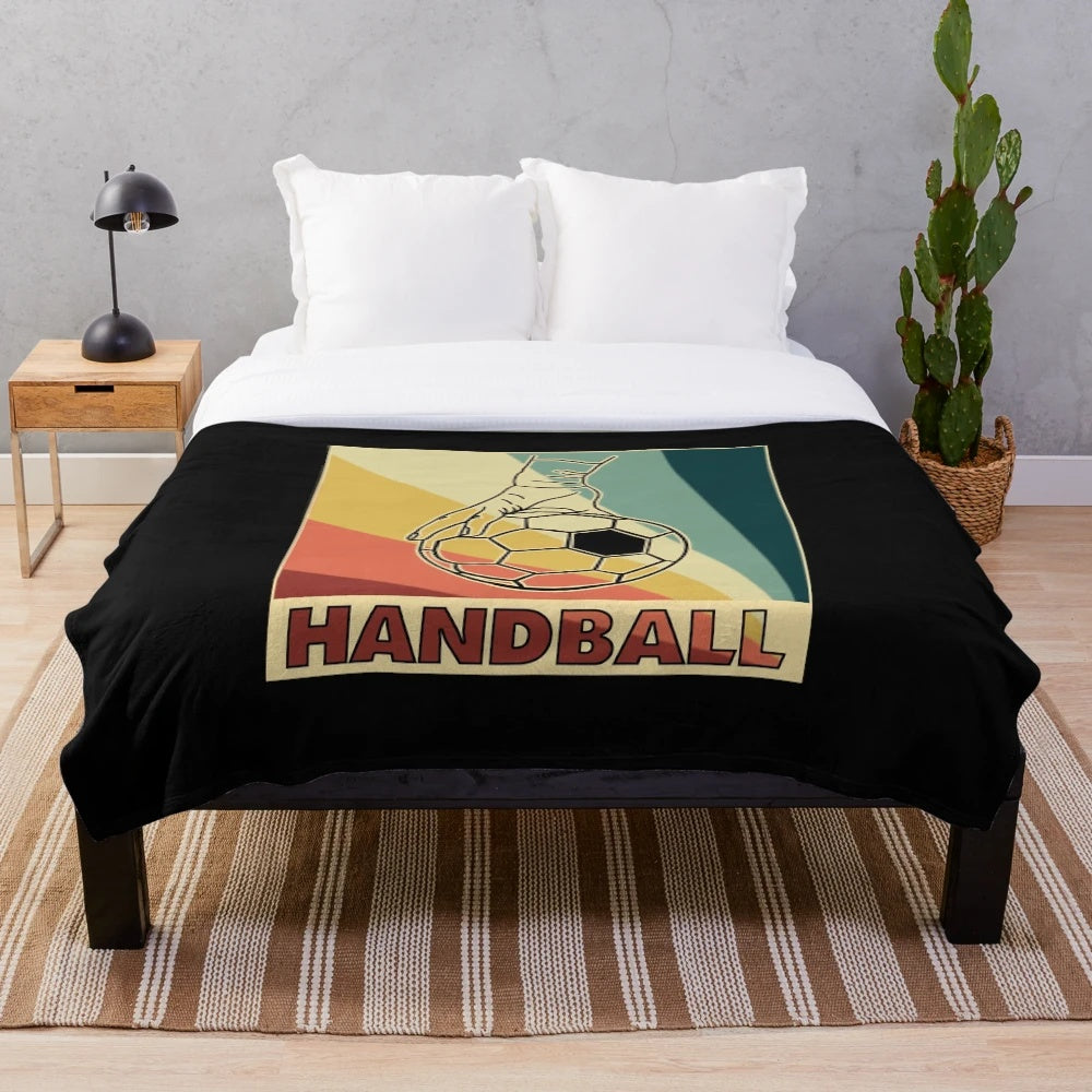 Handball player's plush blanket with retro handball ball design