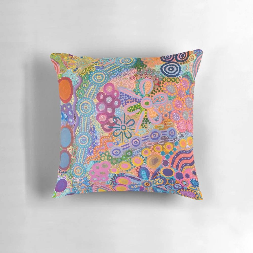 Vibrant aboriginal-inspired artwork on a cozy country-style pillow