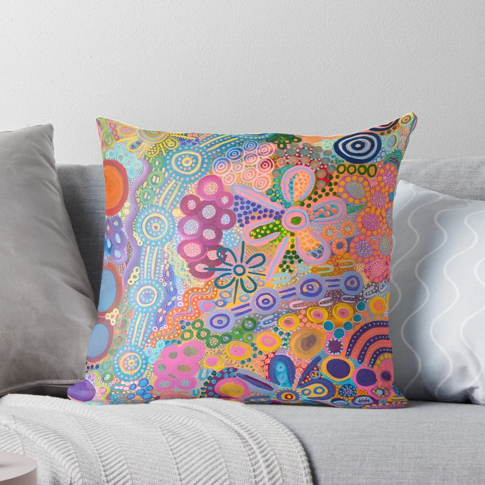 Vibrant aboriginal-inspired artwork on a cozy country-style pillow