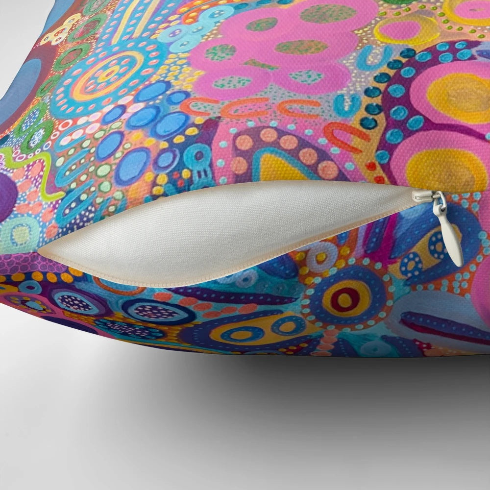 Vibrant aboriginal-inspired artwork on a cozy country-style pillow