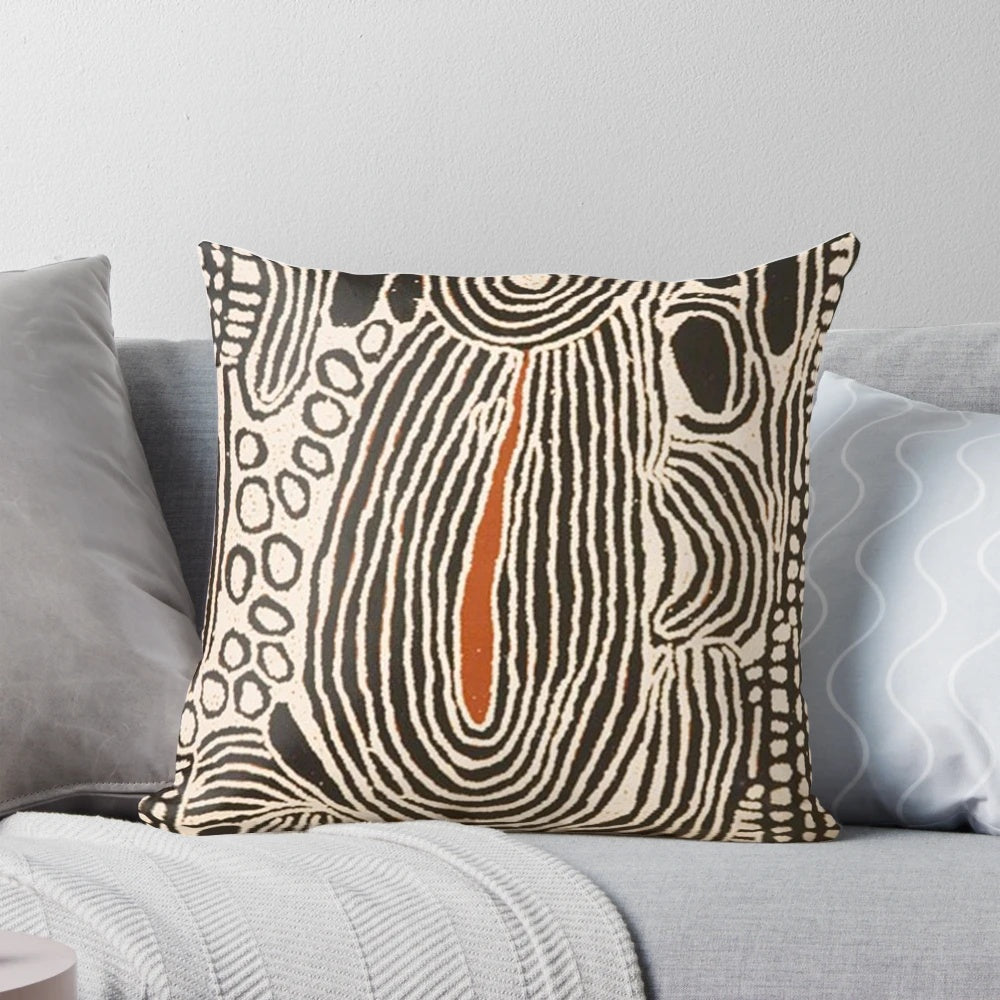 Decorative throw pillow featuring a vibrant Australian Aboriginal-inspired design with dotted patterns and abstract shapes.
