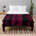 Batik inspired maroon plush blanket with vibrant cultural pattern