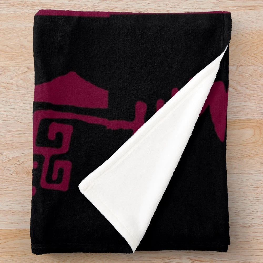 Batik inspired maroon plush blanket with vibrant cultural pattern