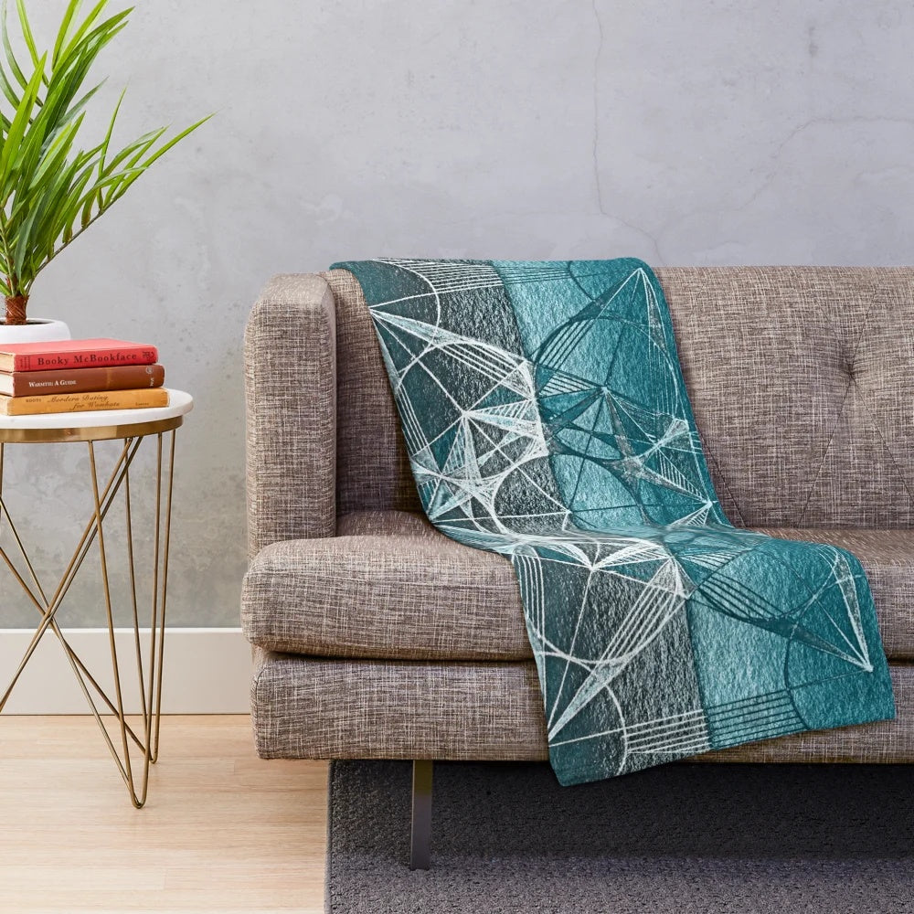 Handcrafted blue plush blanket featuring the sacred geometry design of the Cube of Metatron