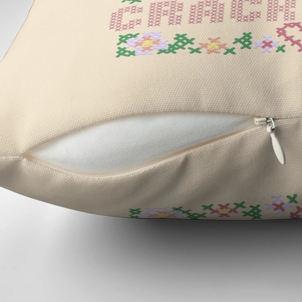 Colorful cross stitch embroidered pillow with hip hop-inspired design