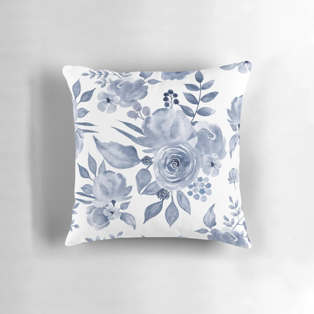 Decorative floral pillow in a Hamptons-inspired blue and white color palette